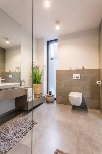 istock Cozy beige toilet with basket 881494736