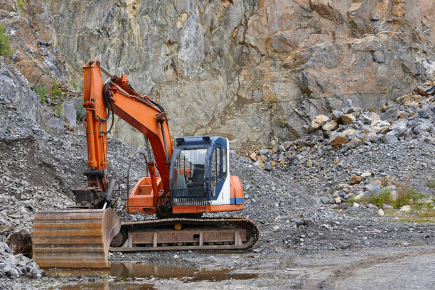 istock Quarry aggregate with heavy duty machinery. Construction industry 881500928