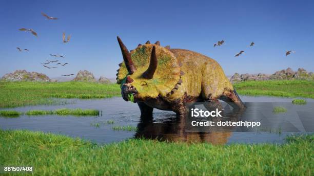 Triceratops Horridus Dinosaur And A Flock Of Pterosaurs From The Jurassic Era Eating Water Plants In Beautiful Landscape Stock Photo - Download Image Now