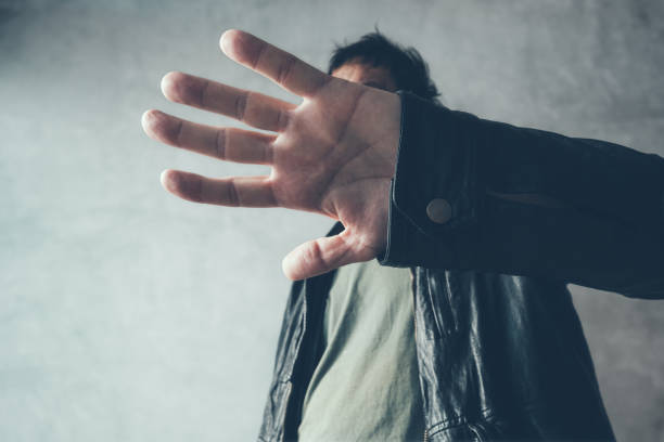 istock Celebrity male hiding face with hands 881507816