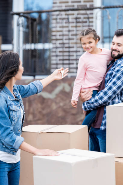 istock family moving into new house 881508122