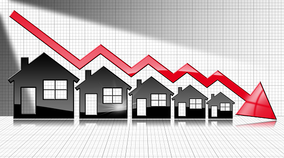 Decreasing real estate sales - 3D illustration of five house-shaped symbols and a graph falling with a red arrow