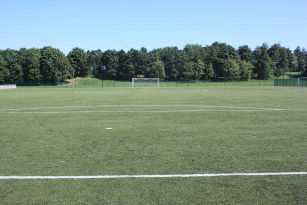 istock Football field on synthetic grass 881512086