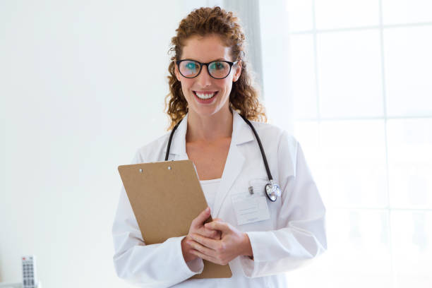 istock Confident female doctor in the office looking at camera. 881512224