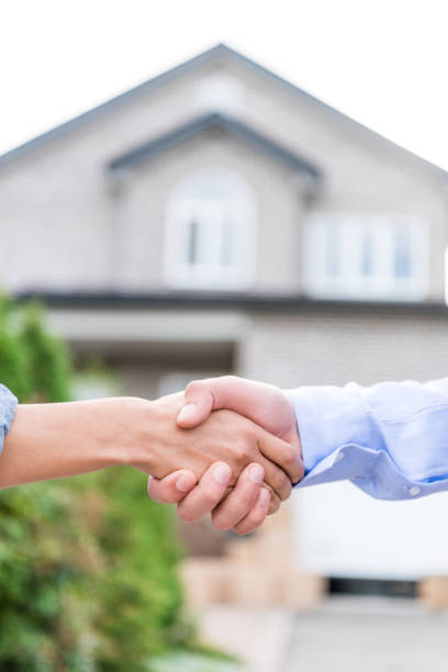 istock Real Estate Agent and client shaking hands 881515140
