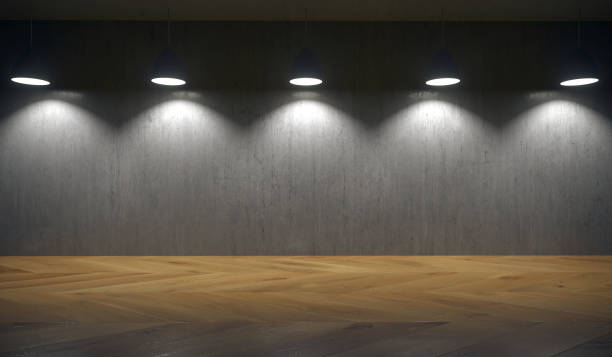 istock Lights Hanging In Front Of Concrete Wall 881524414