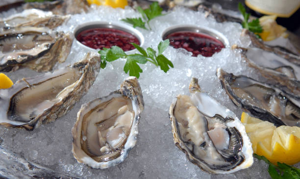 istock Oysters in ice with a lemon and sauce 881531458