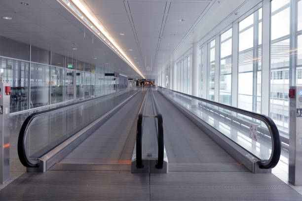 istock long horizontal escalator at international airport terminal 881537772