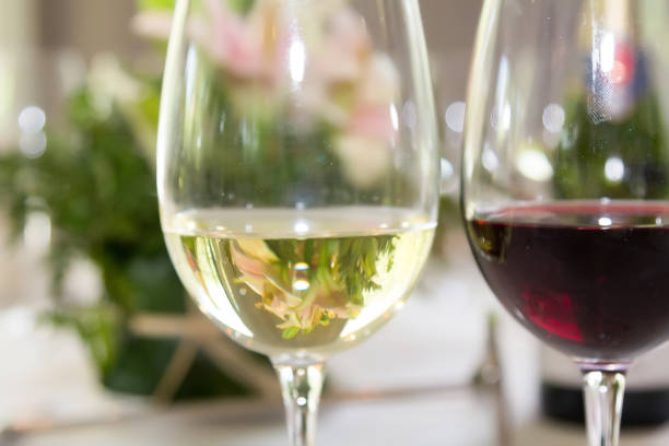istock Crystal glasses with red and white wines 881548284