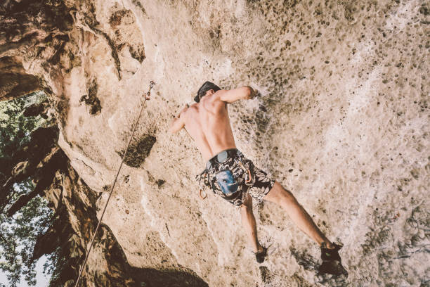 istock Rock climbing bouldering techniques at Railay Beach, Thailand 881550400