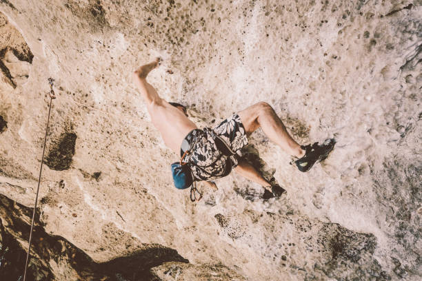 istock Rock climbing bouldering techniques at Railay Beach, Thailand 881552606