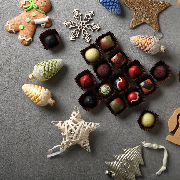 istock Christmas chocolate candy on gray background, holiday 881562346