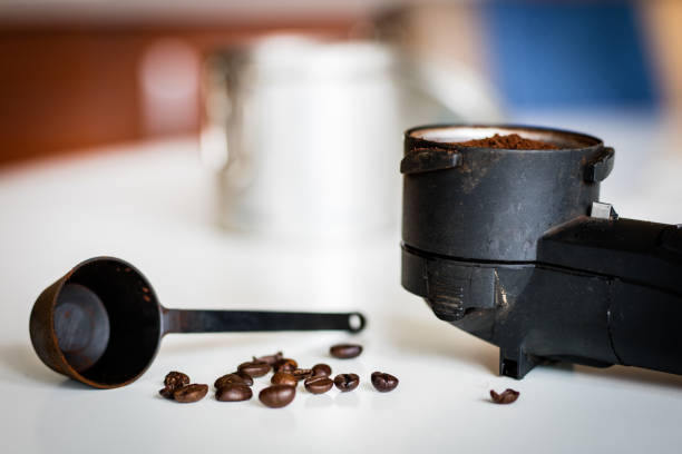 Flush the espresso machine on the kitchen table. The process of preparing coffee in a pressurized machine.