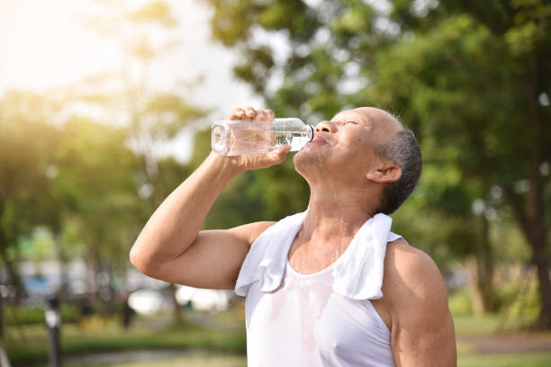 istock Asian senior male drinking water. 881566642
