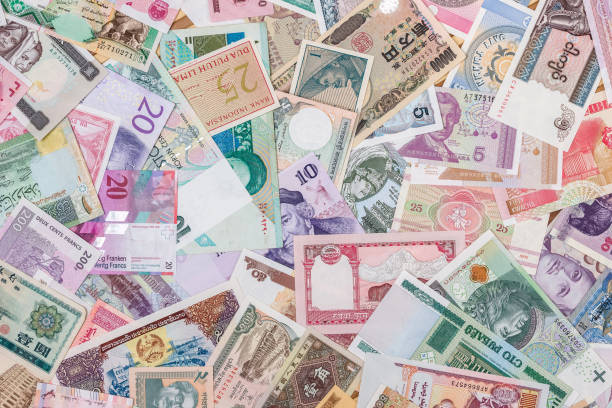 istock world paper money as background. close up 881580064