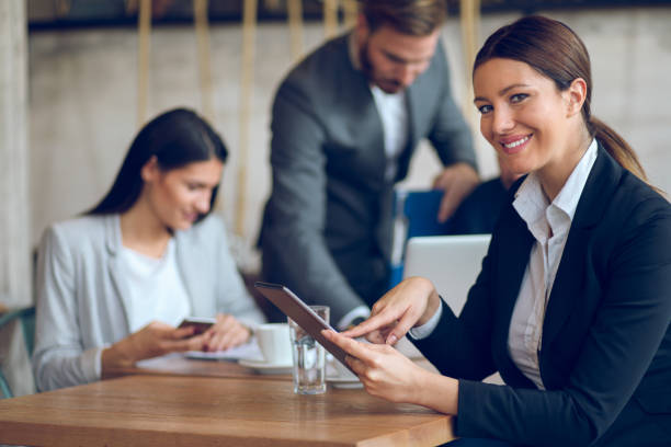 istock Young businesswoman using digital tablet in the office 881584078