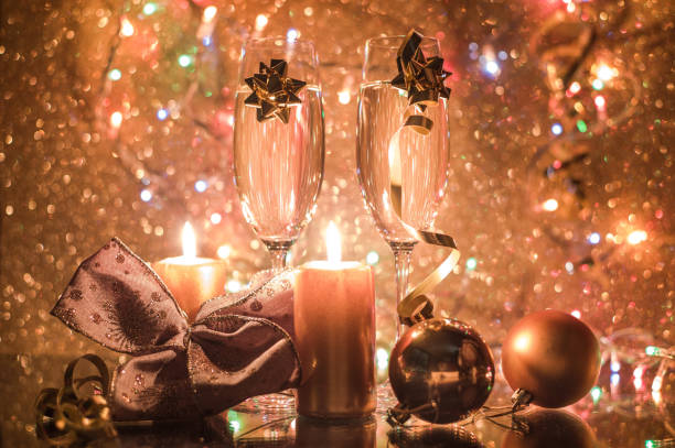 beautiful decoration christmas background with xmas tree, bow, balls, glasses and champange