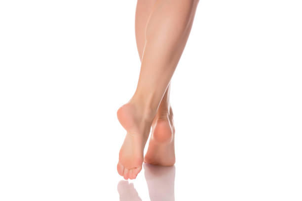 istock Female feet heels on toes isolated 881591408