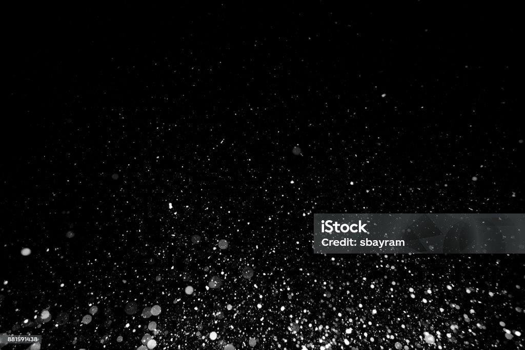 Snow texture on black background for overlay Particle Stock Photo