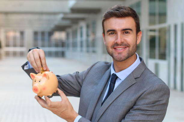 istock Greedy man saving his money 881591758