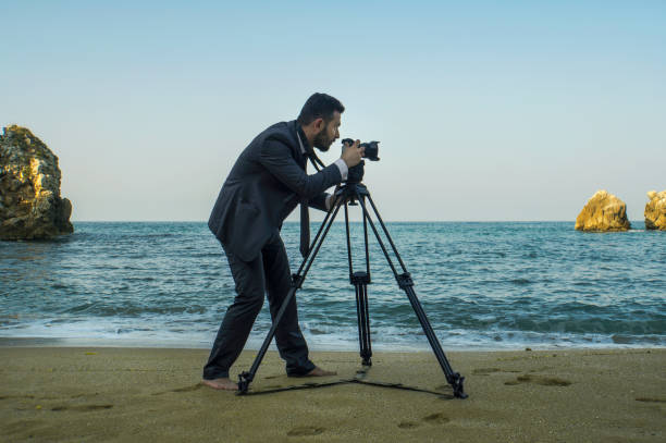 istock Businessman on the Beach - Work Follow 881591972