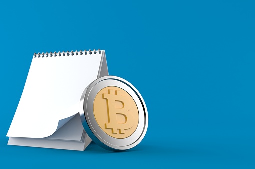 Bitcoin with blank calendar isolated on blue background