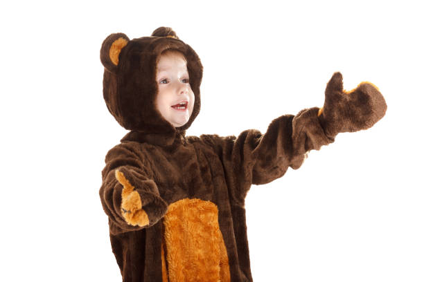 istock Child in a christmas carnival bear costume isolated on white 881601932