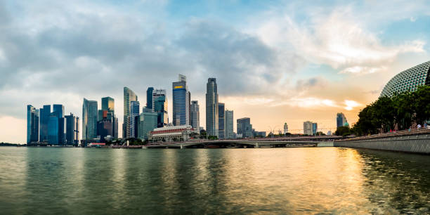 istock Singapore business district skyline during sunset. 881604130