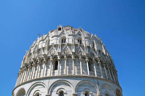 The Pisa Baptistery of St. John, the largest baptistery in Italy, in the Square of Miracles (Piazza dei Miracoli).