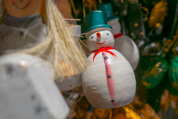 istock hand craved amd painted snowman christmas ornament 881610474