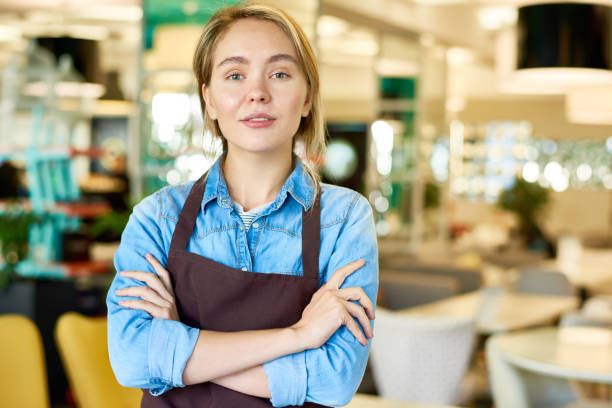 istock Confident Teenage Waitress Working in Cafe 881617444