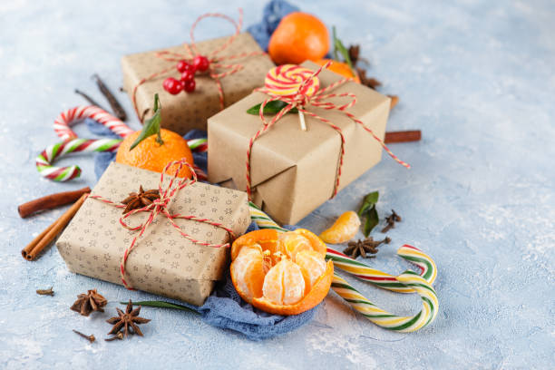 istock Christmas gift box, candy cane, tangerines 881620160