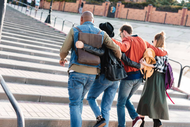 istock multicultural friends walking on street 881626348