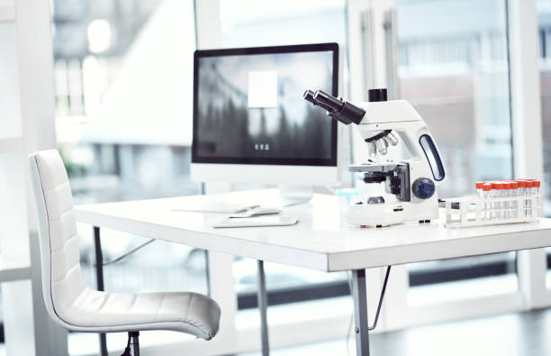 Doctors aways use the right equipment Shot of a desk with scientific equipment on it inside of a laboratory place of research stock pictures, royalty-free photos & images