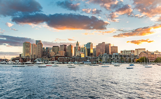 skyline of Boston, USA in sunset with harbor and skyscraper