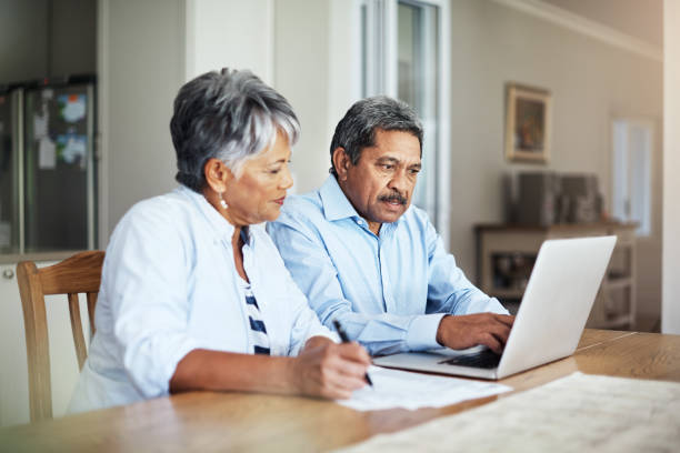 istock Going over their budget with a fine-toothed comb 881635116