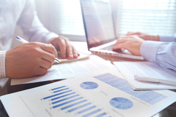 istock business team working with charts and financial data, teamwork 881635754