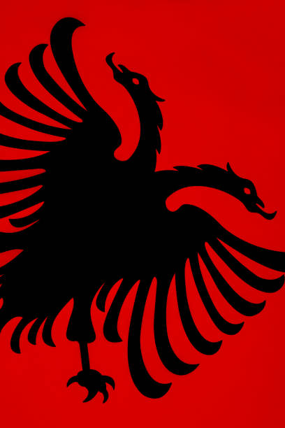 The Flag of Albania - a red flag, with a silhouetted black double-headed eagle in the center, that represents the sovereign state of Albania located in the Balkans.
