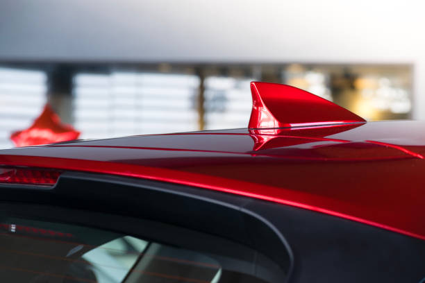 antenna shark fin white color on blurry backgorund. Using wallpaper or background.this car, automotive, transport image.