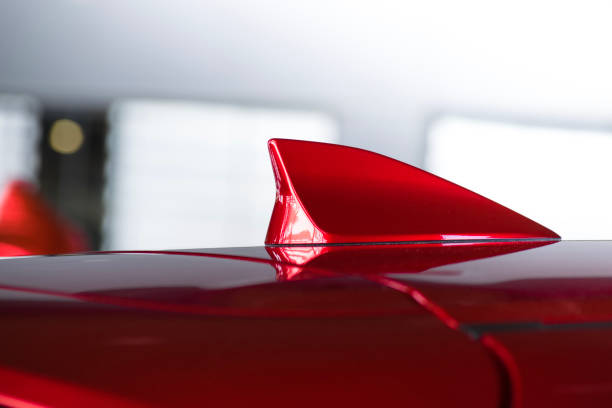 istock antenna shark fin white color on blurry backgorund. Using wallpaper or background.this car, automotive, transport image. 881639308