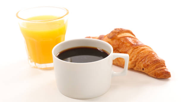 istock coffee,orange juice and croissant 881644782