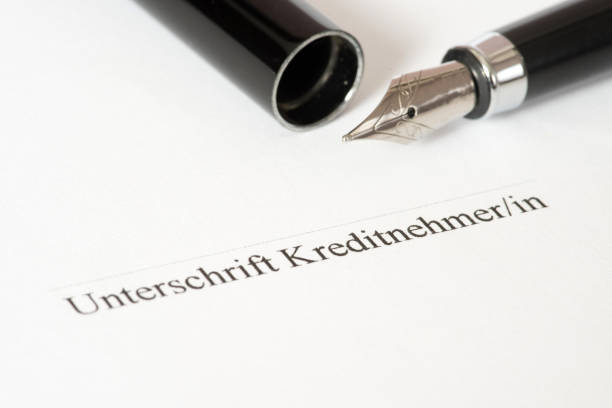 istock A pen and signature on a credit agreement 881648070