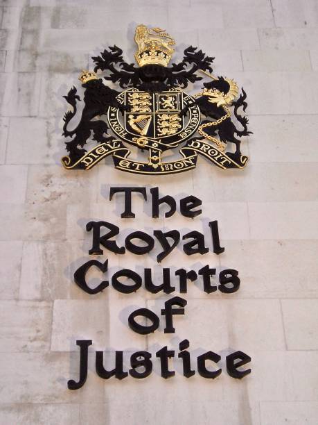 Building Sign on The Royal Courts of Justice London 17th February 2006, The Strand, London, United Kingdom. Opened in 1882 and designed by George Edmund Street, the Royal Courts of Justice, also known as the Law Courts, is located in The Strand, London and is where hearings for the High Court and Court of Appeal of England and Wales take place. mcdermp stock pictures, royalty-free photos & images