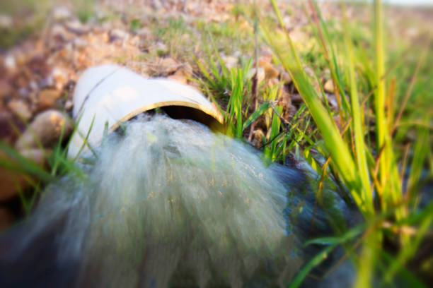 Water pours out of a pipe