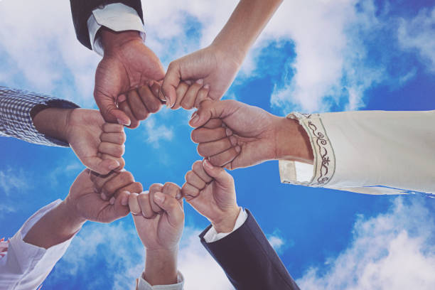 istock Diverse People Hands Fists Together Partnership 881649178