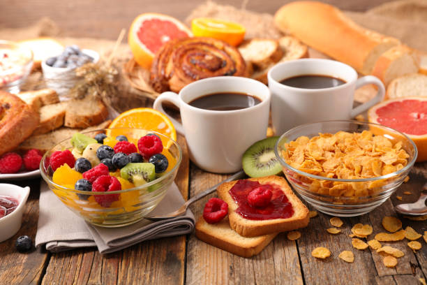 istock breakfast with coffee,croissant and fruit 881653862