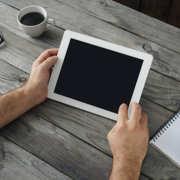 istock digital tablet in man hand close up 881660346
