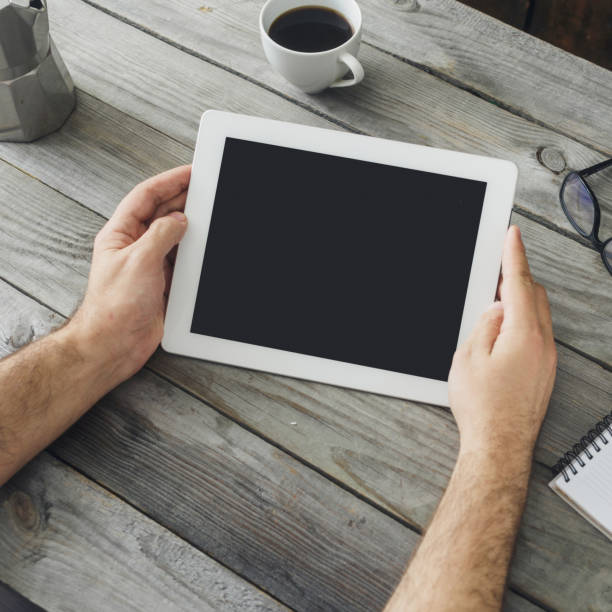 istock digital tablet in man hand close up 881660354