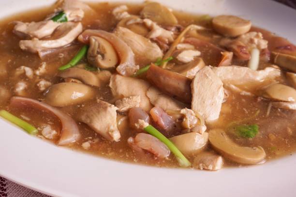 istock mushroom, pork and dried squid fried with oyster sauce 881660528