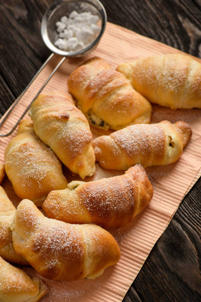 istock Homemade sweet croissants stuffed with cheese. 881663288